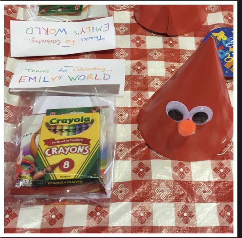 Elmo birthday party favor idea using crayons, goldfish, and cupcake toppers. Easy DIY Elmo party favor for second birthday party. Easy DIY party hat for Elmo themed birthday party.