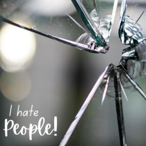 I hate people - a shattered window reflecting the shattered Christian heart who believes "I hate people" is okay to say.